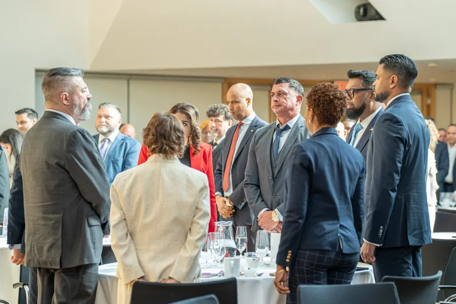 Delegates in conversation at the forum