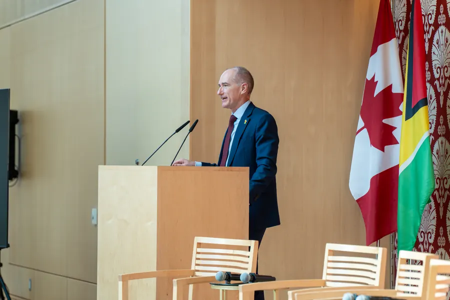A speaker addresses the business forum