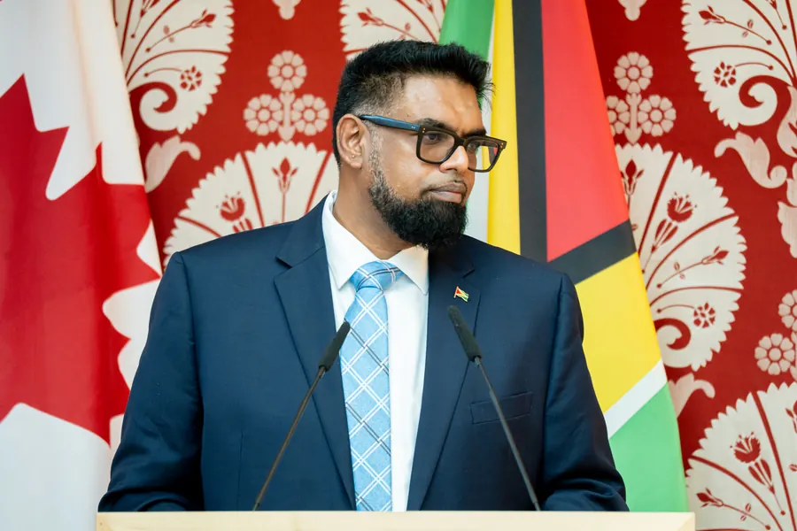 H.E. Dr. Mohamed Irfaan Ali, President of Guyana, at the podium